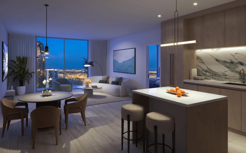 Sala, comedor y cocina de una residencia en Viceroy Brickell con vista nocturna